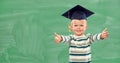 Happy little boy in mortar board showing thumbs up Royalty Free Stock Photo