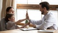 Male doctor greeting with little boy patient in hospital Royalty Free Stock Photo