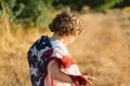 Happy little boy patriot running in the field with American flag Royalty Free Stock Photo