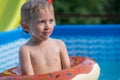 Happy little boy playing with colorful inflatable ring Royalty Free Stock Photo