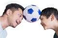 Happy little boy playing football with his father Royalty Free Stock Photo