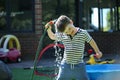 Happy little boy playing with garden hose Royalty Free Stock Photo