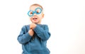 Happy little boy playing with paper glasses, laughing while doing face, on white background, Royalty Free Stock Photo