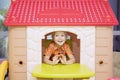 Happy little boy playing in a playhouse Royalty Free Stock Photo