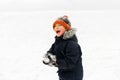 Happy little boy playing with snow in winter Royalty Free Stock Photo