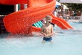 Happy little boy plays in swiming pool