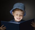 Happy little boy read book at home Royalty Free Stock Photo