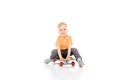 Happy little boy sitting on skateboard Royalty Free Stock Photo