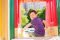 Happy little boy on slide at children playground Royalty Free Stock Photo