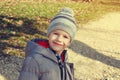 Happy little boy smile in cap at early spring Royalty Free Stock Photo