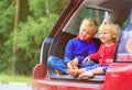 Happy little boy and toddler girl travel by car Royalty Free Stock Photo