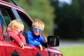 Happy little boy and toddler girl travel by car Royalty Free Stock Photo