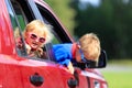 Happy little boy and toddler girl travel by car Royalty Free Stock Photo