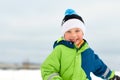 Happy little boy in winter clothes outdoors Royalty Free Stock Photo