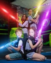 Kids sitting back to back in laser beams Royalty Free Stock Photo