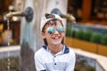 Happy little caucasian boy in cap laughing Royalty Free Stock Photo