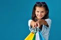 happy little caucasian child girl holds many shopping bags Royalty Free Stock Photo