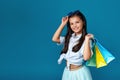 happy little caucasian child girl holds many shopping bags Royalty Free Stock Photo