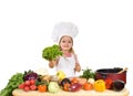 Happy little chef with lots of vegetables Royalty Free Stock Photo