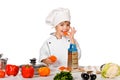 Happy little chef with lots of vegetables. isolated Royalty Free Stock Photo