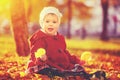 Happy little child, baby girl laughing and playing in autumn Royalty Free Stock Photo