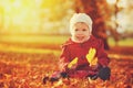 Happy little child, baby girl laughing and playing in autumn Royalty Free Stock Photo