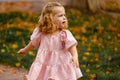 happy little child, baby girl laughing and playing in the autumn on the nature walk outdoors Royalty Free Stock Photo