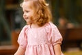 happy little child, baby girl laughing and playing in the autumn on the nature walk outdoors Royalty Free Stock Photo