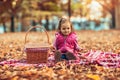 Little child, baby girl laughing and playing in the autumn park Royalty Free Stock Photo