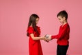 Happy little child boy gives smiling girl a gift box Royalty Free Stock Photo