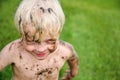 Happy Little Child Covered in Dirt PLaying Outside Royalty Free Stock Photo