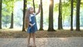 Happy little child girl blowing soap bubbles outside in green park. Outdoor summer activities for children concept Royalty Free Stock Photo