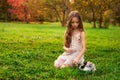 Happy little child girl with cute rabbit. Portrait of kid with pet Royalty Free Stock Photo