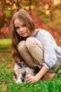 Happy little child girl with cute rabbit. Portrait of kid with pet Royalty Free Stock Photo