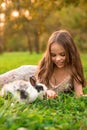 Happy little child girl with cute rabbit. Portrait of kid with pet Royalty Free Stock Photo