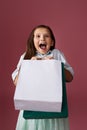 happy little child girl holds many shopping bags Royalty Free Stock Photo