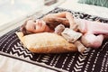 happy little child girl lying on her bed in the morning, waking up in comfortable room