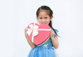 Happy little child girl with red heart gift box isolated on white background. Concept Valentine`s Day Royalty Free Stock Photo