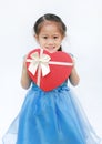 Happy little child girl with red heart gift box isolated on white background. Concept Valentine`s Day Royalty Free Stock Photo