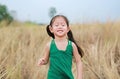 Happy little child girl relaxing in summer field outdoor Royalty Free Stock Photo