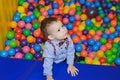 Happy little child playing at colorful plastic balls playground Royalty Free Stock Photo