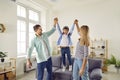 Happy little child playing and having fun with parents in the living room at home Royalty Free Stock Photo