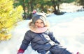 Happy little child playing sitting on snow in winter Royalty Free Stock Photo