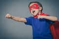 Happy little child playing superhero. Royalty Free Stock Photo