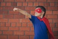 Happy little child playing superhero. Royalty Free Stock Photo