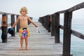 Child with mask, fins going to snorkel in tropical sea Royalty Free Stock Photo