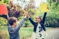 Happy little children celebrating success while giving high five