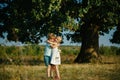 Happy. Little children have fun on fresh air. Funny kids. Walk on countryside. Copy space. Emotional little girl and boy