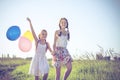 Happy little children playing in the field at the day time. Royalty Free Stock Photo