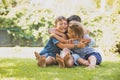 Three little kids are hugging together outdoors Royalty Free Stock Photo